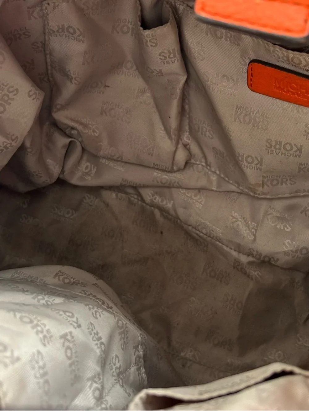 Michael Kors Orange Pebbled Leather Drawstring Tote tassel shoulder bag